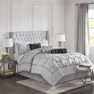 This beautifully tufted bed is from the Laurel bedding collection. Its grey coloring makes this set create a statement in your bedroom. The collection is made from 100% polyester polyoni and has pieced fabric sewn together providing added dimension. It is finished with a smooth edge of fabric that creates a beautiful border around this comforter. Items in the set may come in a rolled or compressed packaging