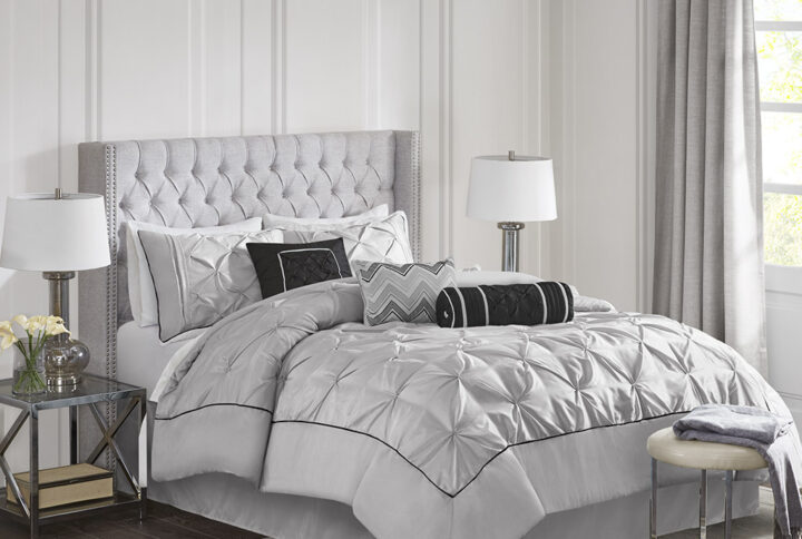 This beautifully tufted bed is from the Laurel bedding collection. Its grey coloring makes this set create a statement in your bedroom. The collection is made from 100% polyester polyoni and has pieced fabric sewn together providing added dimension. It is finished with a smooth edge of fabric that creates a beautiful border around this comforter. Items in the set may come in a rolled or compressed packaging