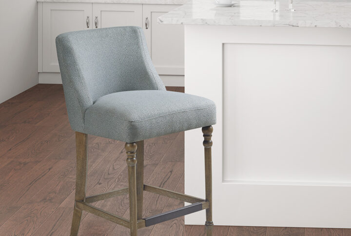 Elevate the look of your dining space with the Martha Stewart Delaney 25" Upholstered Counter Stool. Flaunting an elegant silhouette