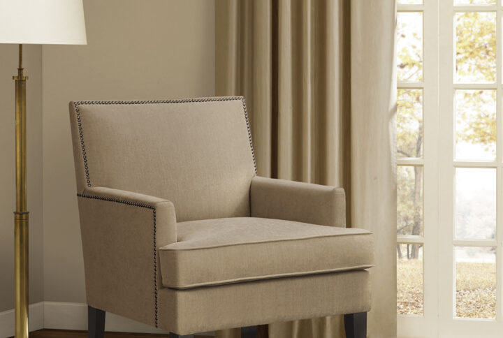 The Madison Park Colton Track Arm Club Chair brings a simple and sharp update to your home decor. This accent club chair features a sleek design with track arms and a nailhead trim along the back and sides