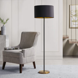 Elevate your home decor with the bold look of the Martha Stewart Hunts Metal Floor Lamp. This floor lamp features a slender metal stem with a black finish and a round