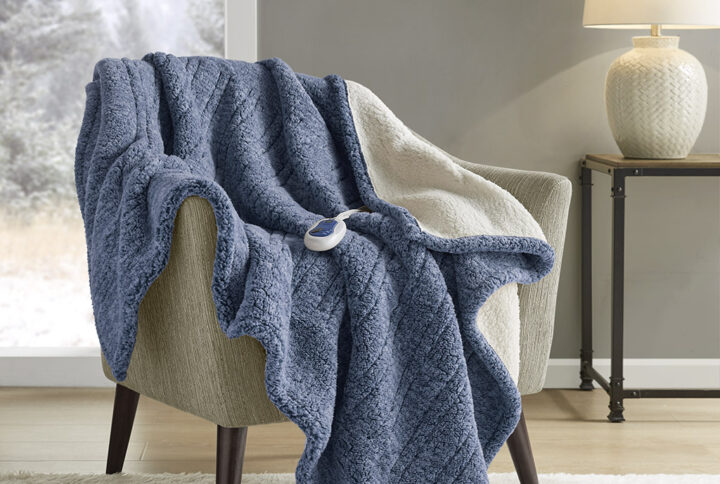 Combine fashion and function seamlessly with this heated throw that will keep you warm and cozy during chilly nights. The sherpa material features a variegated color pattern on front for added style and reverses to a solid sherpa. Three heat settings allow you to easily customize your comfort level to perfection