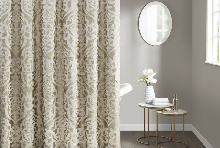 Add a touch of class to your bathroom with our Madison Park Odette Jacquard Shower Curtain. This luxurious textured shower curtain flaunts a gorgeous ivory damask medallion design on a stria tan jacquard ground that adds rich texture and dimension to the lavish look. Measuring 72x72"