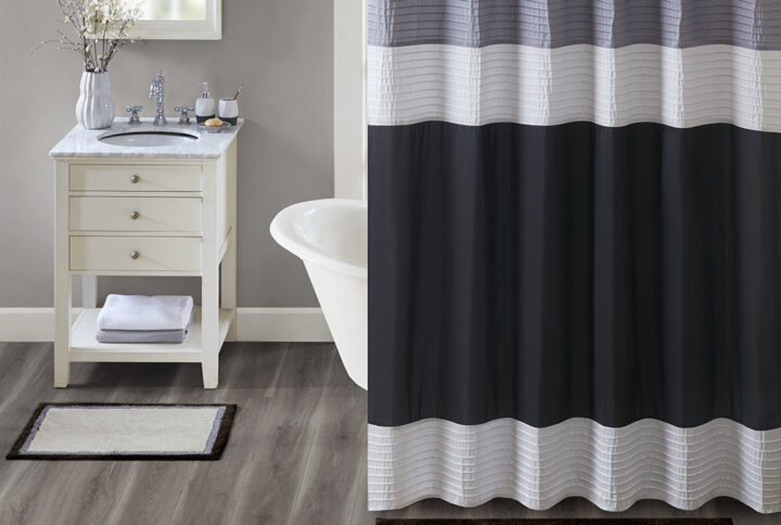 The Madison Park Amherst Cotton Tufted Bath Rug Collection provides a stylish and sophisticated look for your bathroom. Made from 100% tufted cotton