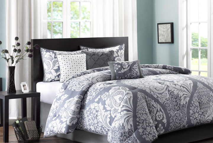 The Madison Park Vienna 7 Piece Cotton Printed Comforter Set offers an eye-catching update to your bedroom decor. A beautifully intricate damask pattern is flaunted across the comforter and shams