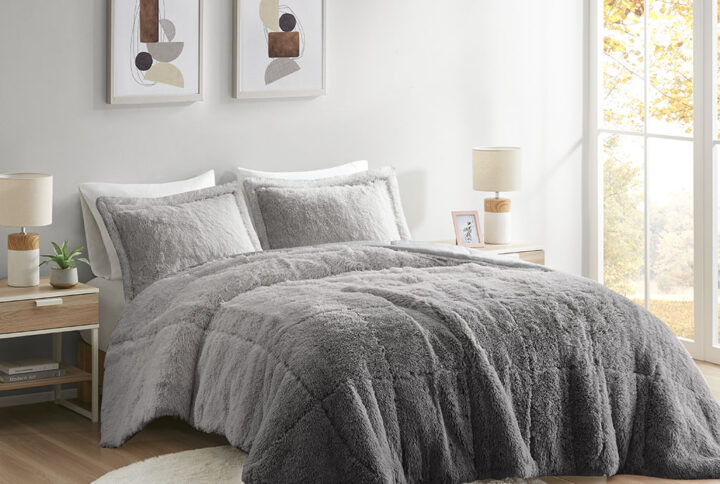 Create a cozy and comfy space with the Intelligent Design Brielle Shaggy Faux Fur Comforter Mini Set. This shaggy fur comforter features an ombre design with a soft