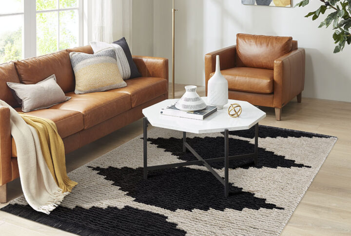 Complete your home decor with the bold allure of the Madison Park Amanda Black & Ivory Modern Area Rug. This plush area rug features a super soft