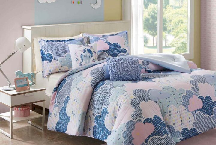 Drift off to dreamland with the whimsical charm of the Urban Habitat Kids Cloud Cotton Printed Comforter Set. The comforter and shams (1 for Twin Sizes) showcase a cute and fluffy cloud motif in a soft colorful palette with a solid reverse. An oblong decorative pillow features all-over ruching and the square pillow features an embroidered unicorn. Made from 100% pre-shrunk cotton