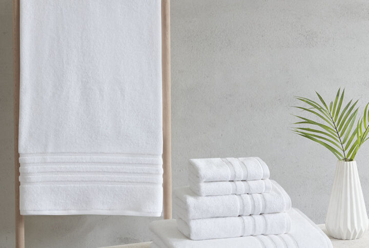 Complete your bathroom decor with our Clean Spaces Nurture Sustainable Antimicrobial 6PC Towel Set. This eco-friendly solid white towel set is made from regenerated cotton and recycled polyester fibers safeguarding our resources for a better carbon footprint