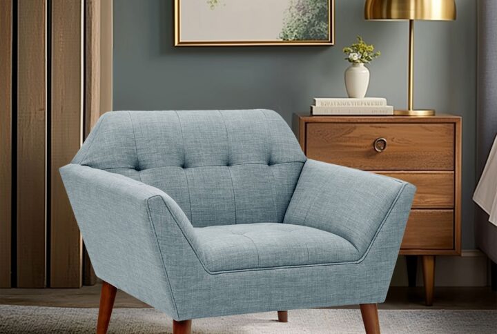 Elevate your living area with the mid-century allure of the INK+IVY Newport Upholstered Armchair. Featuring a wide 37-inch profile and a striking angular silhouette