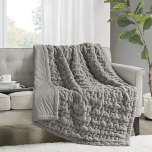 Add a modern and sophisticated touch to any space with the Madison Park Ruched Fur Throw. This throw features a solid ruched fur pattern