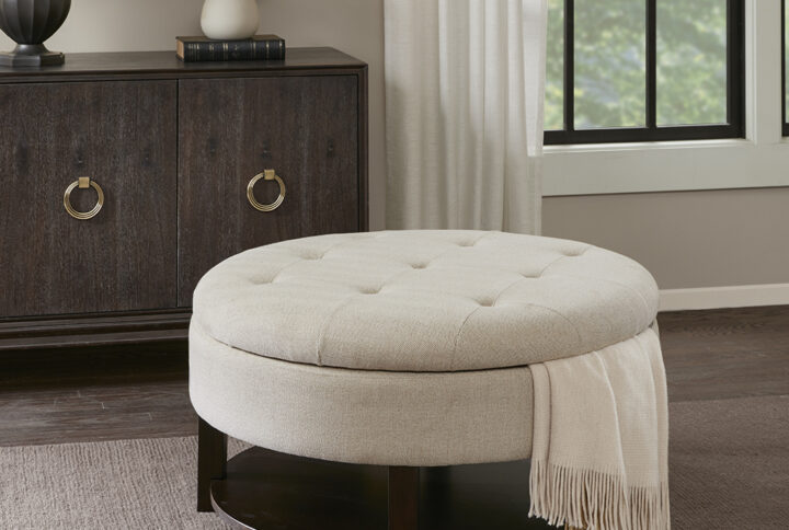 There is no need to sacrifice style for storage with this round storage ottoman. Featuring a tufted top that lifts to reveal ample interior storage space