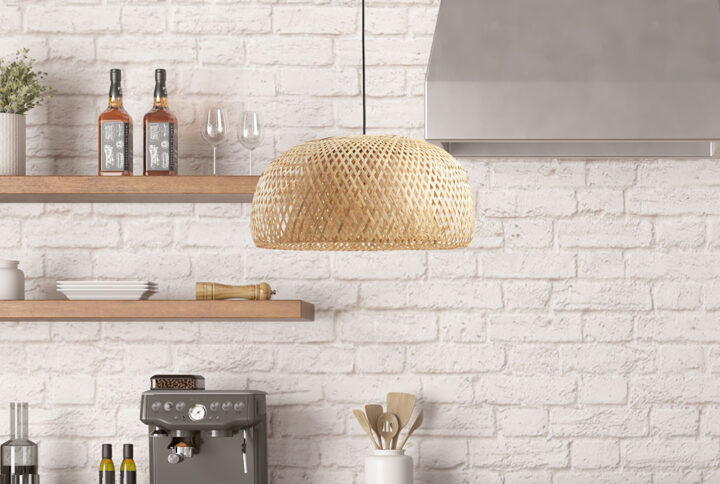 The INK+IVY Astrid Bowl Shaped Bamboo Pendant combines natural and modern styles to create an elevated artistic design. This hanging pendant features a bamboo rattan shade around a glass bowl shade