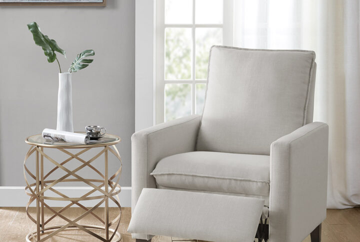 Add extra seating and style to your living room with the sleek design of this modern recliner. Upholstered in an ivory fabric