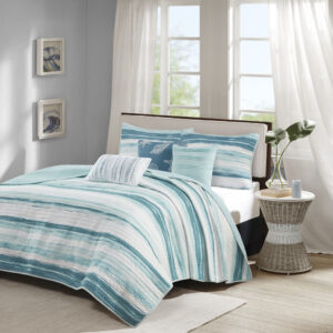 The Madison Park Marina 6 Piece Reversible Quilt Set provides a modern take on the coastal stripe. It's watercolor motif