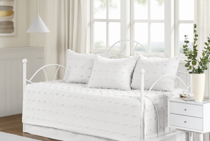 The Urban Habitat Brooklyn Cotton Jacquard Daybed Set brings a soft and charming update to your guest bedroom. This ivory cotton daybed features small tufted chenille dots that create a fresh shabby chic look. The 3 matching shams and a solid bed skirt complement the cotton jacquard daybed set. This bedding set is also OEKO-TEX certified