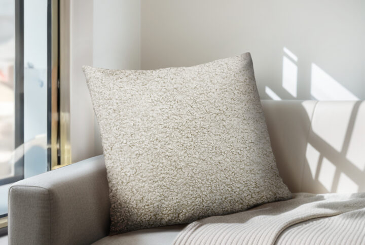 Enhance your living space with the Chapel Hill Tara Solid Boucle Square Pillow. Featuring a soft boucle texture and an off white tone