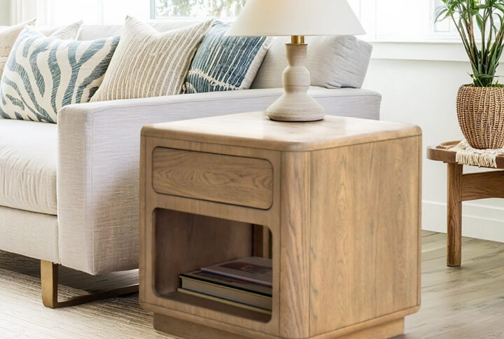 The Chapel Hill Emil End Table combines timeless contemporary style with practical design. Its sleek Driftwood oak finish highlights the beautiful wood grain