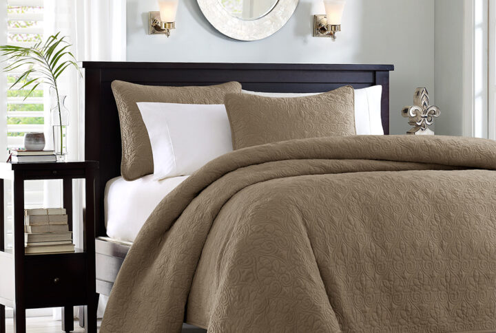 The Madison Park Quebec Reversible Quilt Set offers a charming cottage-inspired update to your bedroom. The quilt and shams (1 in Twin/TwinXL) flaunt a classic stitch pattern that creates a rich depth and texture on the face of the bedding set. Prewashed cotton filling provides added comfort and durability making it the perfect for use in the summer or as a layering piece in the winter. This quilt also has an antimicrobial treatment that provides built-in freshness protection