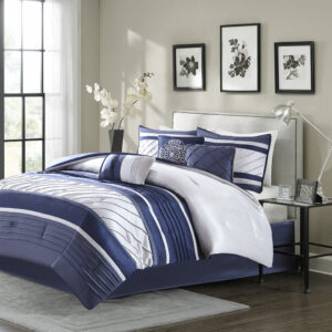 The Madison Park Blaire 7 Piece Comforter Set offers a rich traditional update to your bedroom decor. The comforter and matching shams feature pieced lustrous silk fabric and pintucking details