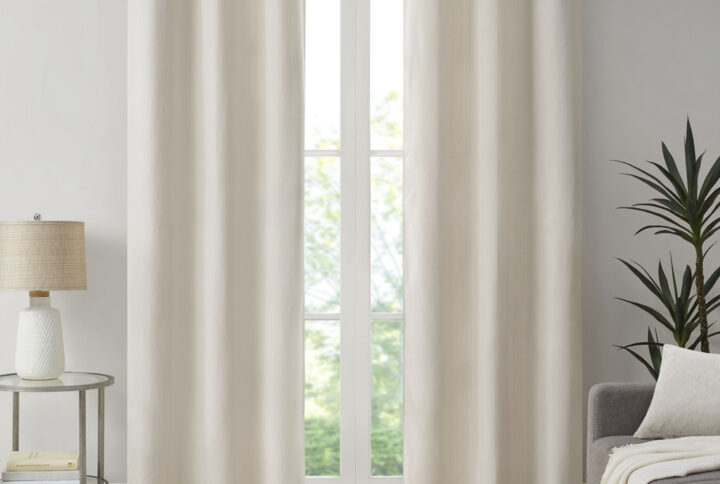 Create a stylish and comfortable space with the Madison Park Galen Basketweave Room Darkening Window Panel Pair. These room darkening window curtains are made from a basket weave texture base fabric that creates a natural look and feel. A thermal foambacking on the reverse provides energy efficiency and serves as an effective barrier to soften exterior light and noise. When closed
