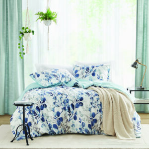 Bask in our breathable seersucker botanical bedding set with a reversible striped print