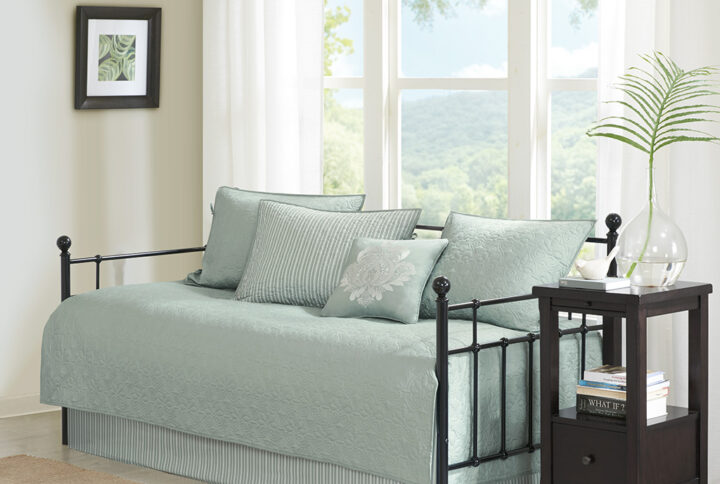 The Madison Park Quebec 6 Piece Reversible Daybed Cover Set offers a charming cottage-inspired update to your guest bedroom. The daybed cover and 3 shams flaunt a classic stitch pattern that creates a rich depth and texture on the face of the bedding set. A square decorative pillow with elegant embroidery and a striped bed skirt add the finishing touches to the daybed set. This reversible daybed cover fits a Twin size mattress and also has an antimicrobial treatment that provides built-in freshness protection