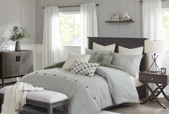 This farmhouse styled cotton clip jacquard comforter features a pieced design with striped pattern and decorative buttons
