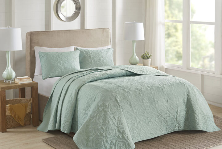 This 3 Piece reversible bedspread set offers a simple and stylish addition to your bedroom decor. A quilted medallion technique is displayed on the seafoam bedspread and shams