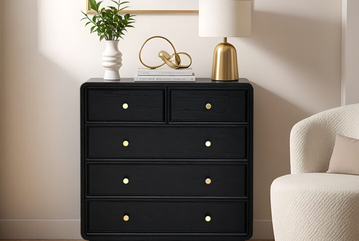 The Chapel Hill Deco dresser combines Art Deco sophistication with practicality. Its sleek Black Satin finish and durable sealed surface offer both elegance and durability. Featuring two half-width and three full-width drawers on high-quality glides