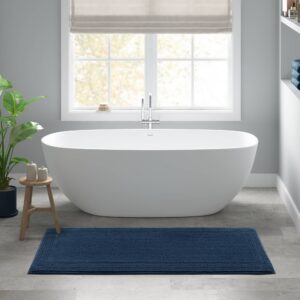 The Madison Park Signature Splendor 100% Cotton Tufted 3000 GSM Reversible Bath Rug brings incredible comfort and softness to your bathroom decor. This 100% cotton bath rug features a superior tufted top construction in a heavy 3000gsm weight