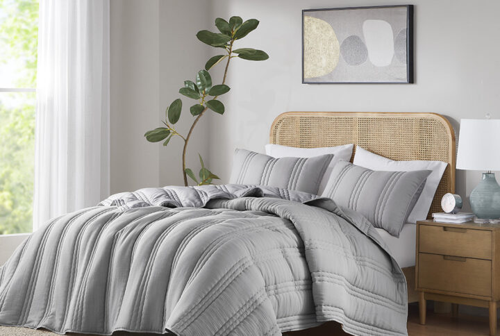 Create a cozy and inviting look for your bedroom with this soft poly gauze quilt set. The quilt and shams feature a channel quilting pattern and a crinkle texture for visual interest and dimension. The quilt is filled with hypoallergenic polyester that contains no allergens and is dust proof