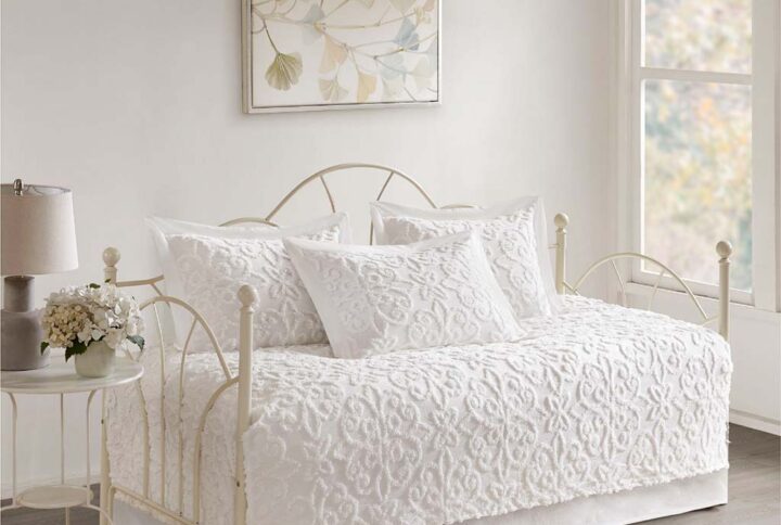 Give your guest bedroom a soft and cozy look with the Madison Park Sabrina 5 Piece Tufted Cotton Chenille Daybed Set. This cotton daybed cover fits a Twin size mattress and features a classic medallion design that adds dimension and charm to the top of the bed. Three matching shams repeat the pattern seen on top of the bed to create a beautiful coordinated look
