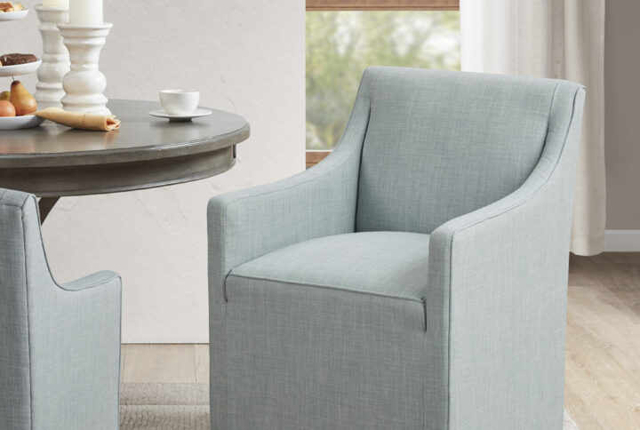 The Madison Park Charlotte Dining Chair blends timeless elegance with modern functionality. Designed to mimic the classic slipcovered look without the upkeep