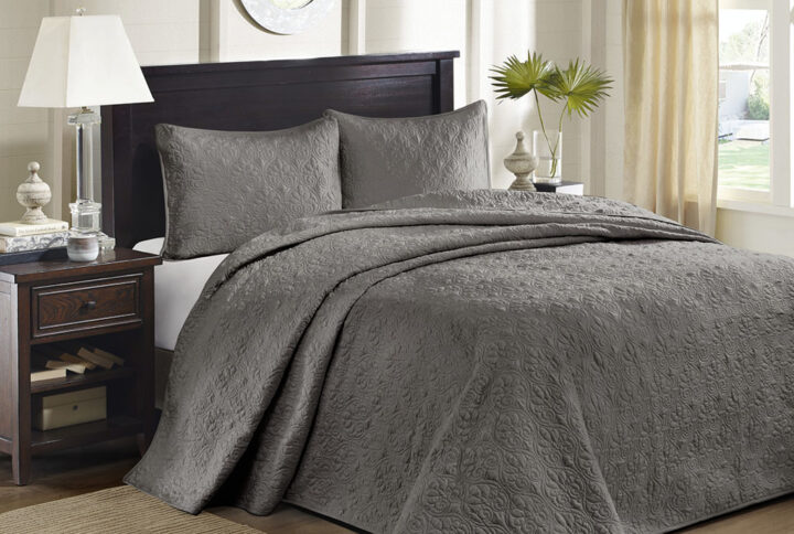The Madison Park Quebec Reversible Bedspread Set offers a charming cottage-inspired update to your bedroom. The reversible bedspread and shams (1 in Twin/TwinXL) flaunt a classic stitch pattern that creates a rich depth and texture on the face of the bedding set. Prewashed cotton filling provides added comfort and durability
