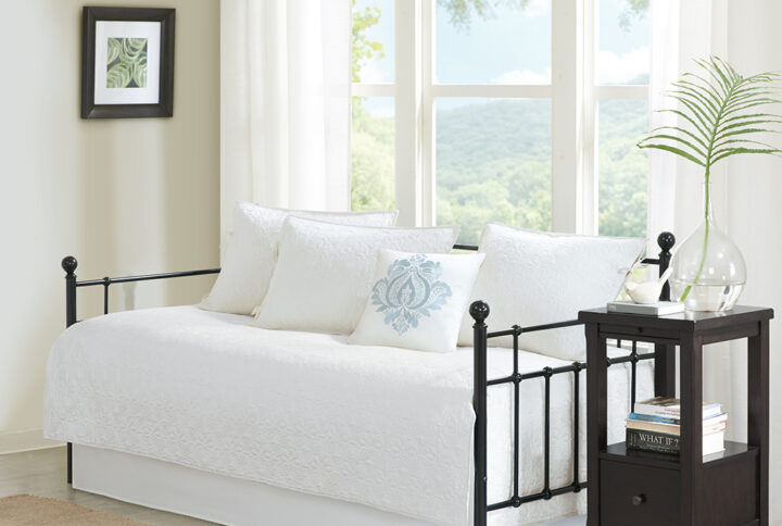 The Madison Park Quebec 6 Piece Reversible Daybed Cover Set offers a charming cottage-inspired update to your guest bedroom. The daybed cover and 3 shams flaunt a classic stitch pattern that creates a rich depth and texture on the face of the bedding set. A square decorative pillow with elegant embroidery and a solid bed skirt add the finishing touches to the daybed set. This reversible daybed cover fits a Twin size mattress and also has an antimicrobial treatment that provides built-in freshness protection