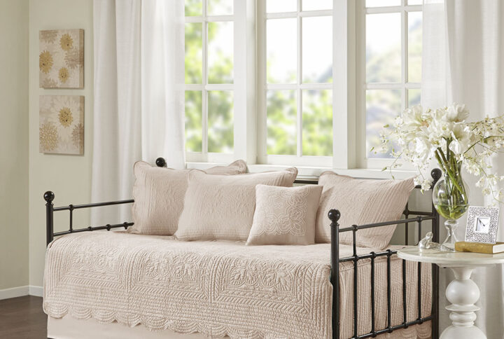The Madison Park Tuscany 6 Piece Reversible Scalloped Edge Daybed Cover Set offers a charming cottage-inspired update to your guest bedroom. The daybed cover and 3 shams flaunt a classic stitch pattern with scalloped edges that add an elegant touch to your bedroom. A square decorative pillow with elegant embroidery and solid bed skirt add the finishing touches to the daybed set. This country daybed cover also has an antimicrobial treatment that provides built-in freshness protection