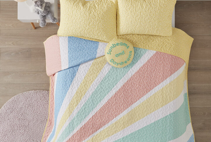 Add a burst of color to your kid’s room with the Urban Habitat Kids Rory Rainbow Sunburst Reversible Cotton Quilt Set. This cotton quilt features a colorful sunburst pattern with a confetti print on the reverse