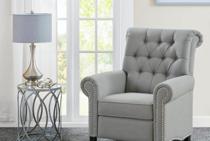 Add a sophisticated touch to your living room with the Madison Park Aidan Push Back Recliner. Featuring a high button-tufted back and rolled arms