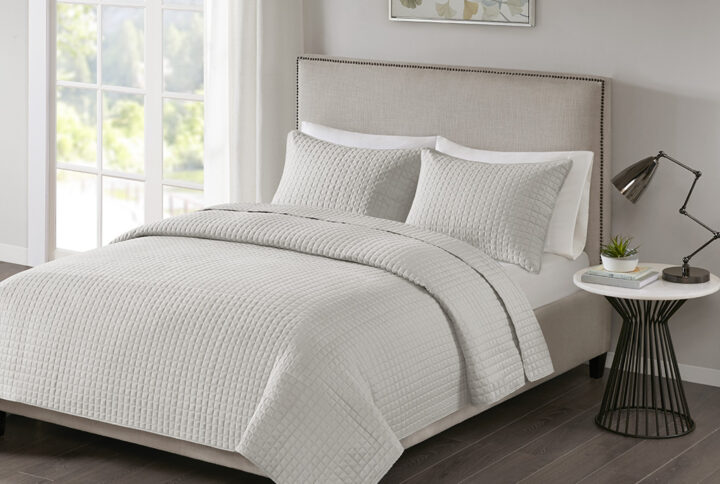 Introduce simple and casual comfort to your bedroom with the 510 Design Otto 3 Piece Reversible Quilt Set. The quilted quilt and shams feature a square checkered pattern in a rich grey hue that complements and adds texture to any decor style. Machine washable for easy care