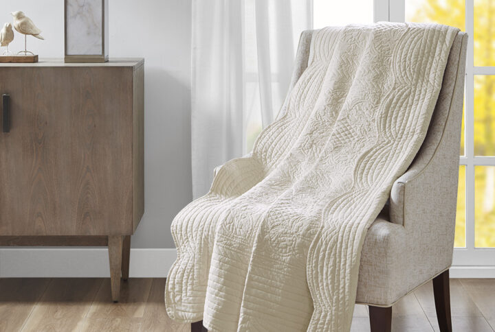 Tuscany is the perfect quilted throw for a new solid look. The decorative stitch pattern pairs easily with your existing decor and will sure to add a new decorative element with the beautiful scalloped edges. This quilted throw is filled with cotton filling and features a polyester microfiber fabrication on the face and the reverse. Its prewashed finish gives a worn in appearance to this decorative throw.