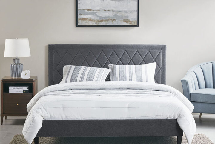 Give your bedroom a chic modern update with the 510 Design Rowen King Quilted Upholstered Platform Bed Frame. This platform bed frame is upholstered in rich charcoal fabric and features elegant diamond quilted tufting along the headboard