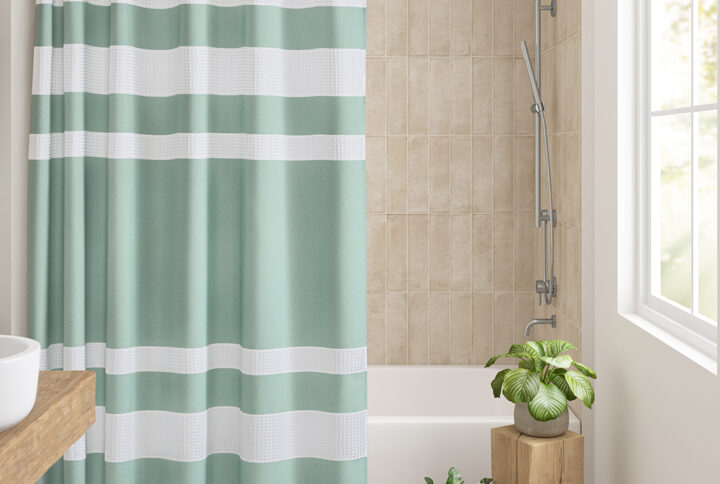Update your space with the Madison Park Spa Waffle Shower Curtain with 3M Treatment. Featuring a fresh and updated stripe design