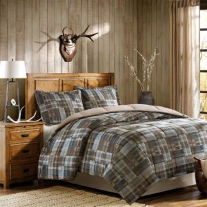 The Woolrich White River Down Alternative Comforter Mini Set is a classic and cozy update for your bedroom. This ultra-soft cozyspun comforter features a blue and brown plaid print with a chocolate brown reverse for a neutral touch. Softspun fabric is an alternative to flannel that is more durable and lightweight. Matching shams add dimension and charm to the bedding set