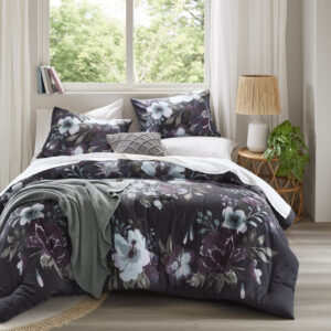 Transform your bedroom into a serene retreat with the Madison Park Jolene 3 Piece Cotton Floral Printed Comforter Set. This Full/Queen comforter set features a dark grey and plum floral pattern on a 100% cotton face