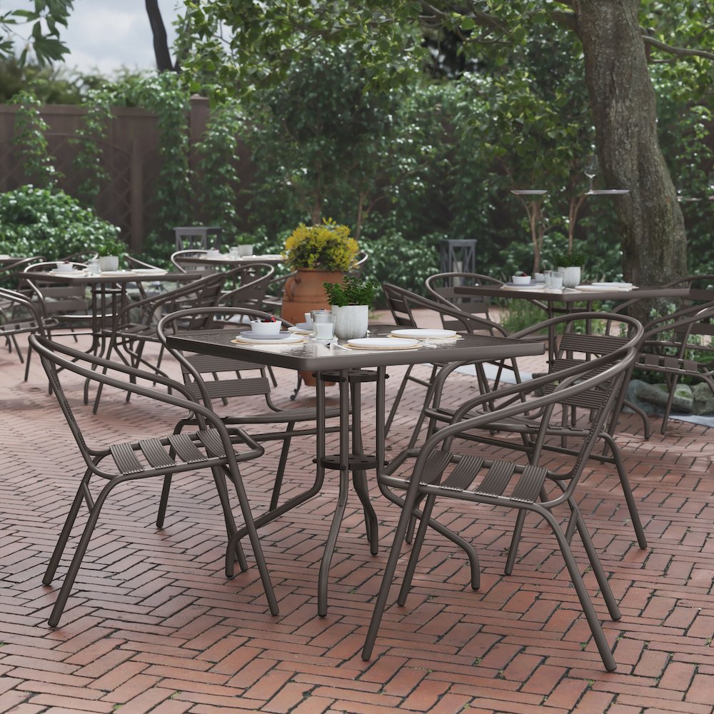 31.5” Square Glass Top Metal Table with 4 Bronze Aluminum Slat Stack Chairs