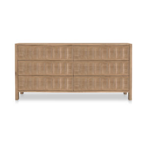 Some dressers store clothes. Roland stores confidence. Its carved drawer fronts bring a steady rhythm to the room—deep grooves and geometric patterning that feel sculptural without getting loud. The solid oak construction keeps everything feeling light but grounded