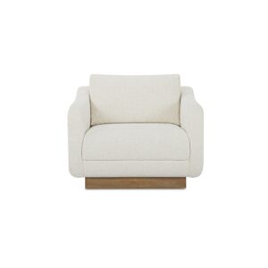 The Keane lounge chair's oversized silhouette invites serene repose