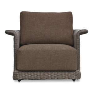 The Meredith accent chair's graceful tulip silhouette and curved armrests create visual interest