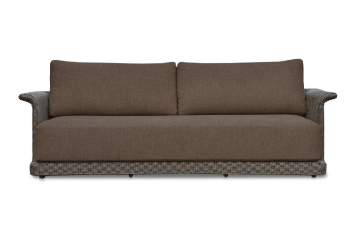 The Meredith sofa's graceful tulip silhouette and curved armrests create visual interest
